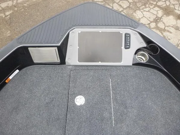 Slide: The Image of 2025 Ranger 622FS Pro boat dashboard with control panel and carpeted surface. - 36