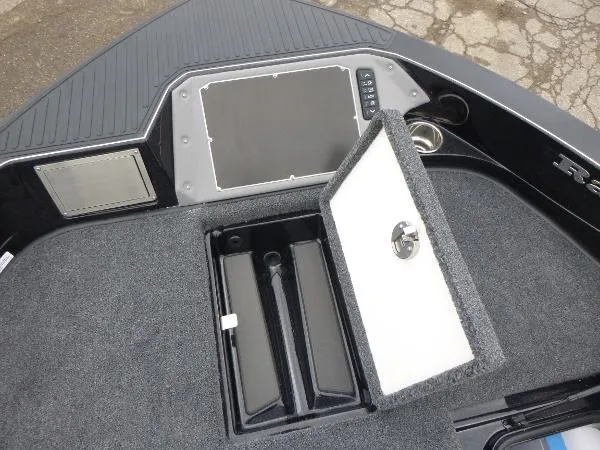 Slide: The Image of 2025 Ranger 622FS Pro boat deck with open storage compartment and control panel. - 37