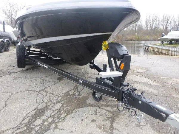 Slide: The Image of 2025 Ranger 622FS Pro boat on trailer, parked near a lake. - 4