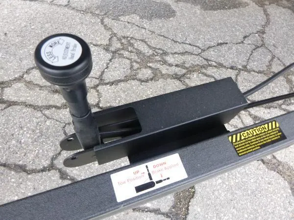 Slide: The Image of Trailer hitch mechanism on a 2025 Ranger 622FS Pro boat, showing caution labels and controls. - 5