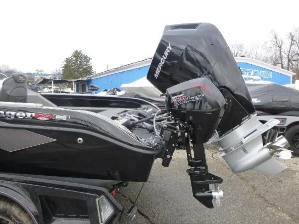 Slide: The Image of 2025 Ranger 622FS Pro boat with Mercury outboard motor, parked outdoors. - 9