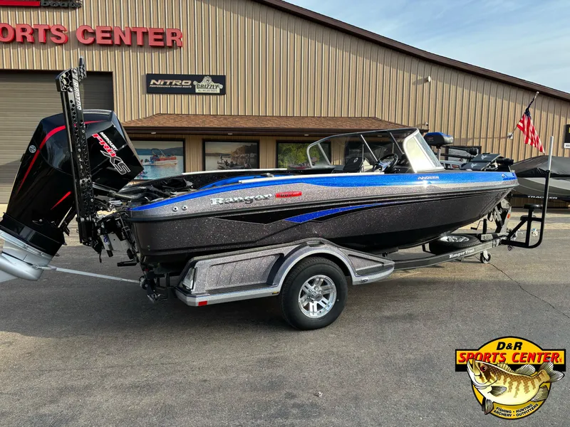 Slide: The Image of 2025 Ranger 1880MS boat at D&R Sports Center, featuring sleek design and powerful engine. - 2