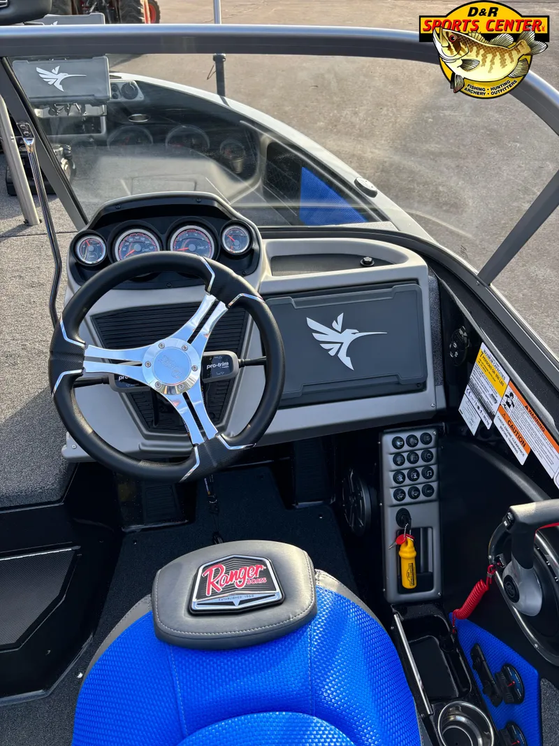 Slide: The Image of 2025 Ranger 1880MS boat dashboard with steering wheel and control panel. - 8