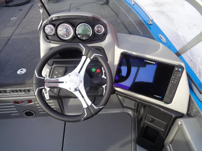 Slide: The Image of 2025 Ranger 621FS Cup Equipped boat dashboard with steering wheel and navigation display. - 10