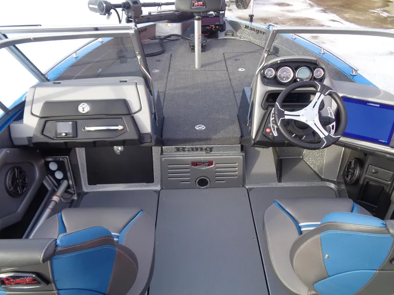 Slide: The Image of Interior of 2025 Ranger 621FS Cup Equipped boat with modern dashboard and seating. - 11