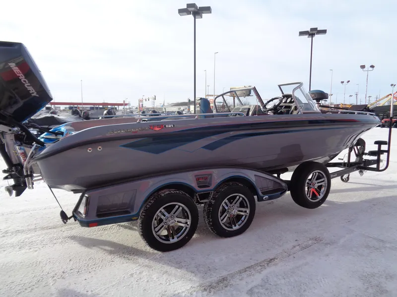 Slide: The Image of 2025 Ranger 621FS Cup Equipped boat on trailer in snowy parking lot. - 2
