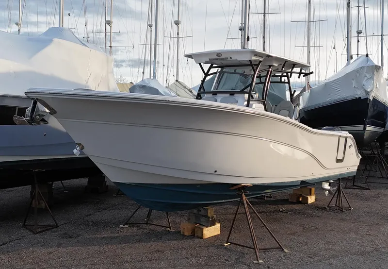 Slide: The Image of 2022 Sea Fox 328 boat on stands in a marina setting. - 0