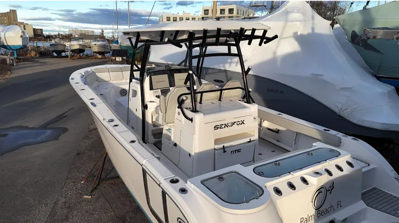 Slide: The Image of 2022 Sea Fox 328 boat docked, featuring sleek design and modern equipment. - 1