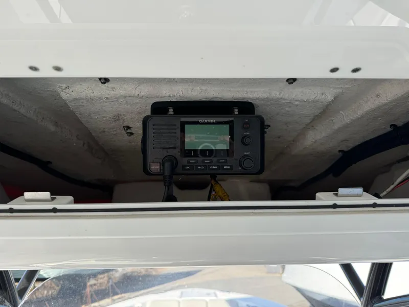 Slide: The Image of 2022 Sea Fox 328 boat with mounted marine radio in storage compartment. - 14