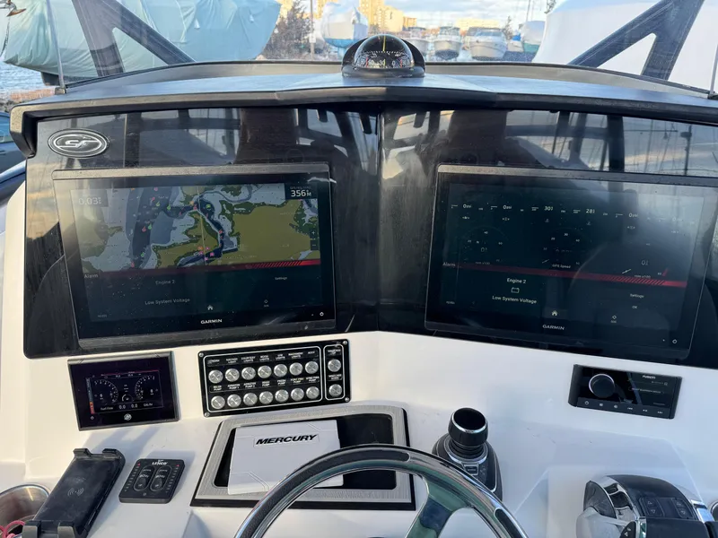 Slide: The Image of Dashboard of 2022 Sea Fox 328 boat with navigation screens and controls. - 18