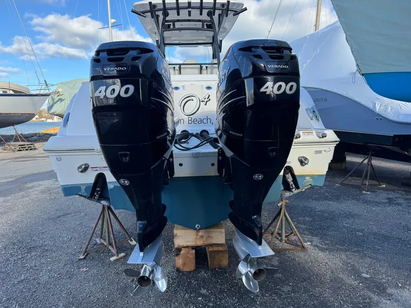 Slide: The Image of 2022 Sea Fox 328 with twin 400 horsepower outboard engines, docked on land. - 22