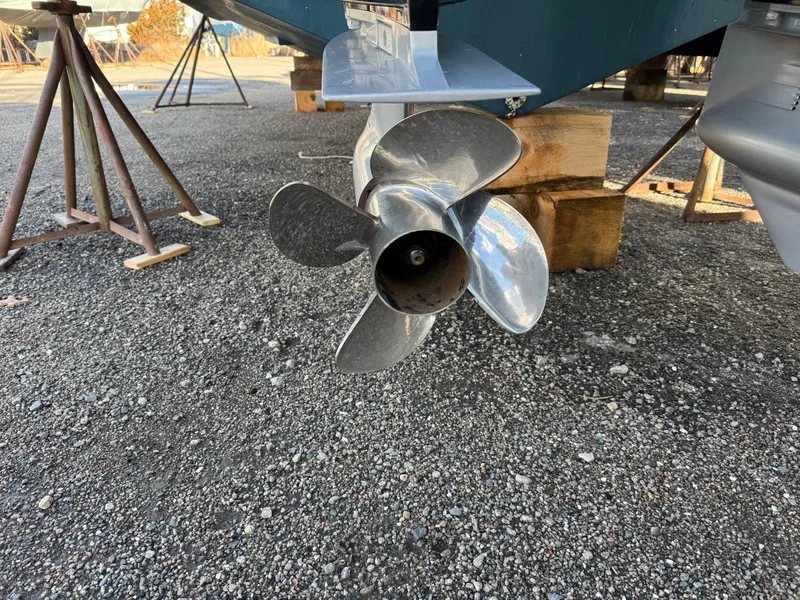 Slide: The Image of Propeller of 2022 Sea Fox 328 boat on gravel, supported by stands. - 23