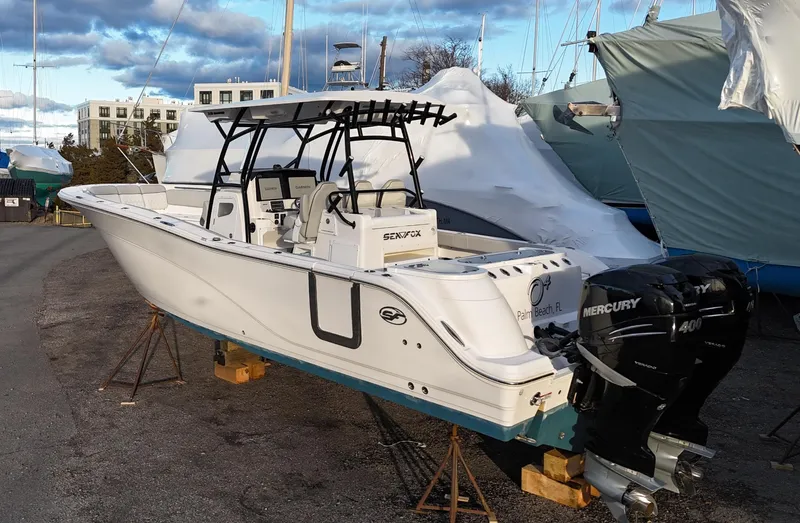 Slide: The Image of 2022 Sea Fox 328 boat with Mercury engines, docked outdoors. - 3
