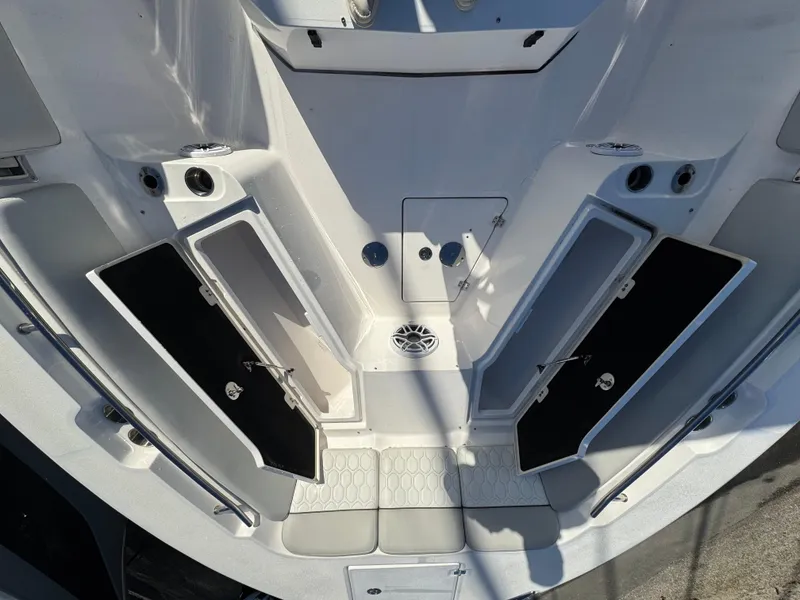 Slide: The Image of 2022 Sea Fox 328 boat deck with open storage compartments and sleek design. - 33