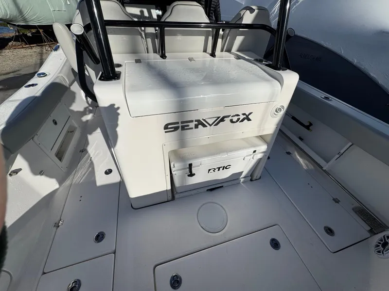Slide: The Image of 2022 Sea Fox 328 boat interior with seating and storage compartments. - 37