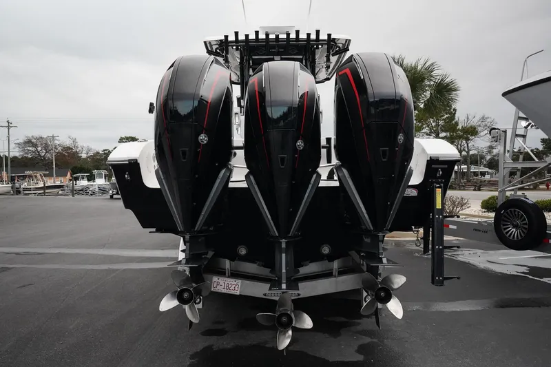 Slide: The Image of 2023 Fountain Bluewater 38 Tournament Edition with triple outboard engines, rear view. - 10