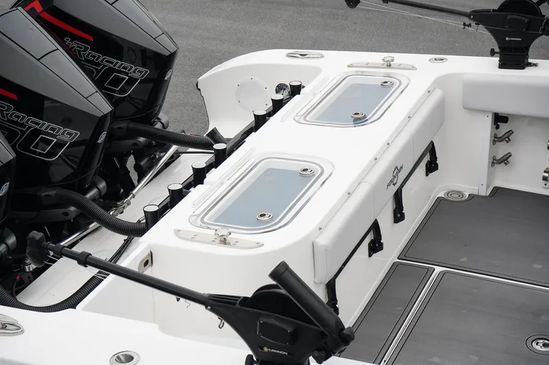 Slide: The Image of 2023 Fountain Bluewater 38 Tournament Edition boat deck with twin Mercury engines. - 13