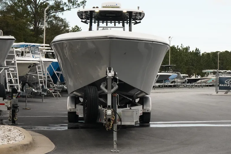 Slide: The Image of 2023 Fountain Bluewater 38 Tournament Edition boat on trailer in marina. - 2
