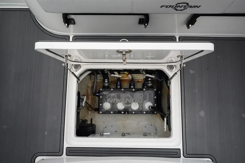 Slide: The Image of Open hatch of 2023 Fountain Bluewater 38 Tournament Edition boat, revealing engine compartment. - 22