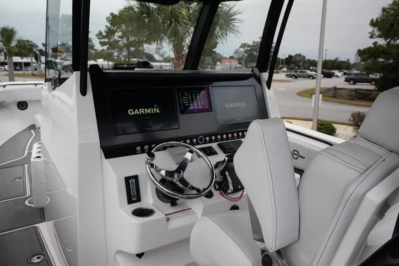 Slide: The Image of 2023 Fountain Bluewater 38 Tournament Edition boat cockpit with Garmin navigation system. - 25