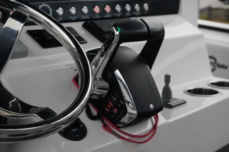 Slide: The Image of Close-up of 2023 Fountain Bluewater 38 Tournament Edition boat controls and steering wheel. - 26