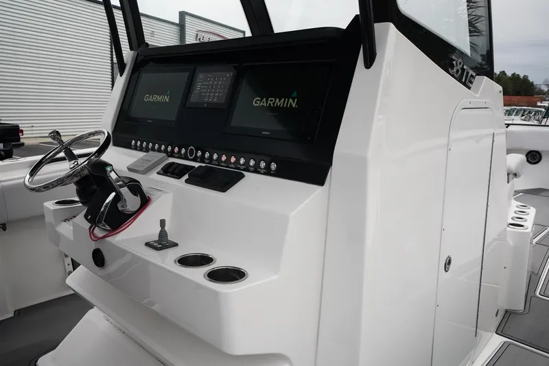 Slide: The Image of 2023 Fountain Bluewater 38 Tournament Edition boat console with Garmin displays. - 30