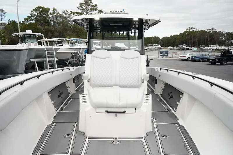 Slide: The Image of 2023 Fountain Bluewater 38 Tournament Edition boat with white seating and sleek design. - 36