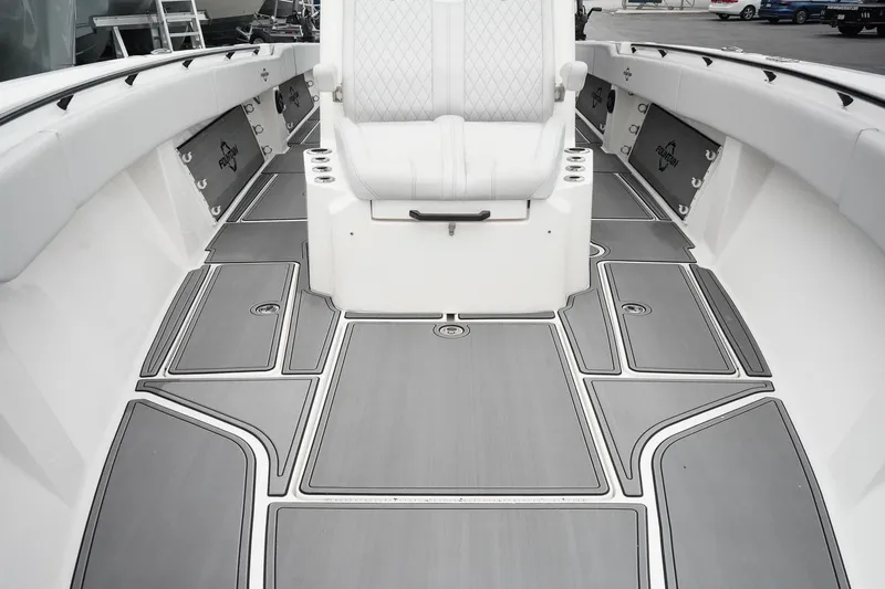Slide: The Image of 2023 Fountain Bluewater 38 Tournament Edition boat interior with sleek seating and modern flooring. - 37