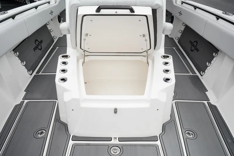 Slide: The Image of 2023 Fountain Bluewater 38 Tournament Edition boat interior with open storage compartment. - 39