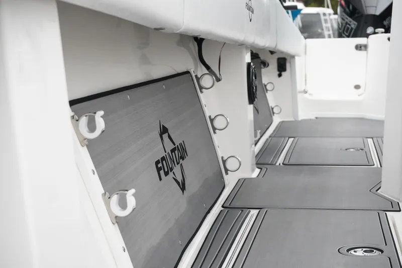 Slide: The Image of 2023 Fountain Bluewater 38 Tournament Edition boat interior with branded storage compartments. - 41