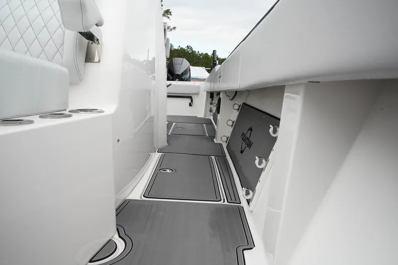 Slide: The Image of 2023 Fountain Bluewater 38 Tournament Edition boat interior with sleek, modern design and storage compartments. - 43