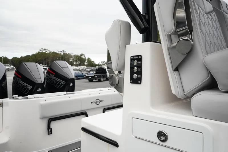 Slide: The Image of 2023 Fountain Bluewater 38 Tournament Edition boat interior with seating and controls. - 48