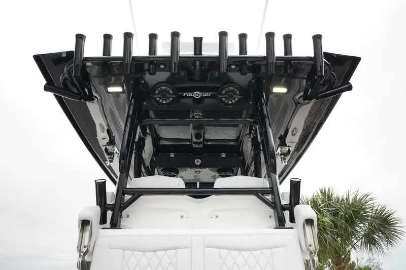 Slide: The Image of 2023 Fountain Bluewater 38 Tournament Edition boat with rod holders and speakers. - 49