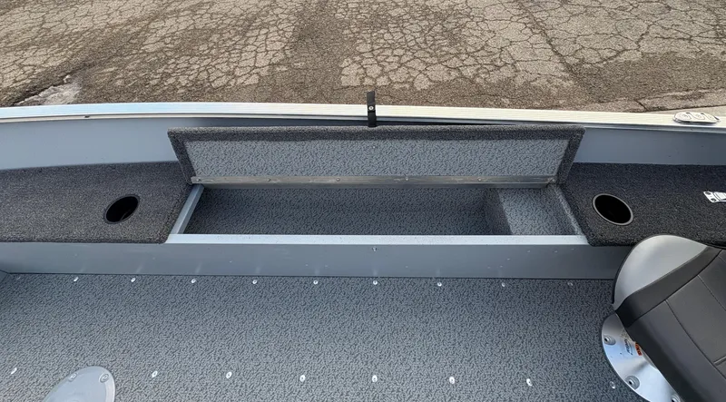 Slide: The Image of 2025 Lund 1600 Fury Tiller boat interior with open storage compartment. - 17
