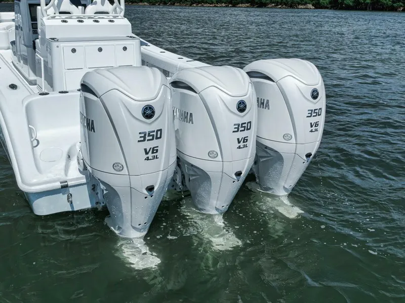 Slide: The Image of 2025 Yellowfin 36 Offshore boat with triple Yamaha 350 V6 engines on water. - 10