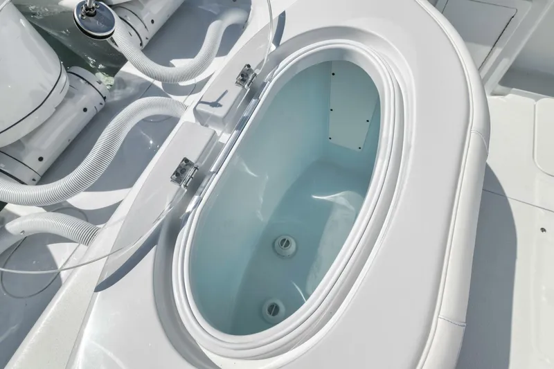 Slide: The Image of Livewell on 2025 Yellowfin 36 Offshore boat, featuring sleek white design and modern fittings. - 11