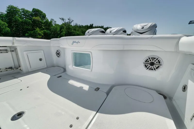 Slide: The Image of 2025 Yellowfin 36 Offshore boat interior with speakers and storage compartments. - 12