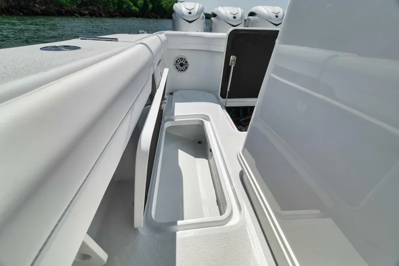 Slide: The Image of 2025 Yellowfin 36 Offshore boat interior with storage compartment and sleek design. - 13