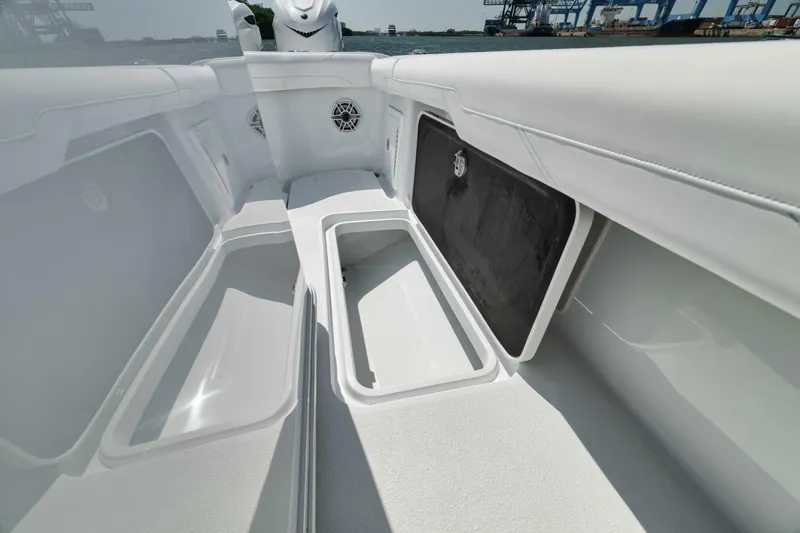 Slide: The Image of 2025 Yellowfin 36 Offshore boat interior with open storage compartments. - 15