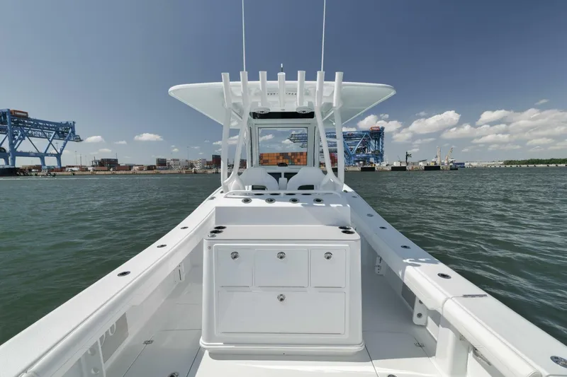 Slide: The Image of 2025 Yellowfin 36 Offshore boat on water, featuring spacious deck and modern design. - 19