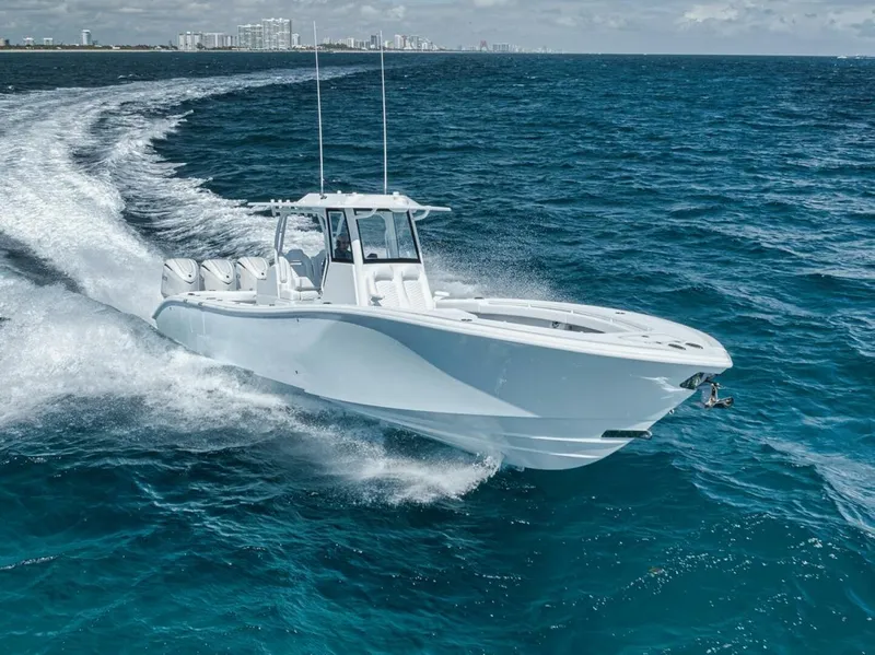 Slide: The Image of 2025 Yellowfin 36 Offshore boat cruising on open ocean waters. - 2