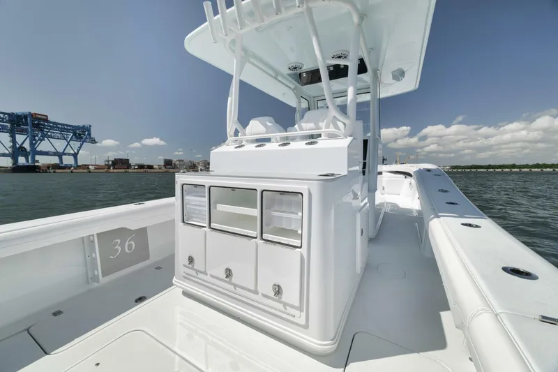 Slide: The Image of 2025 Yellowfin 36 Offshore boat, sleek design, spacious deck, ocean backdrop. - 21