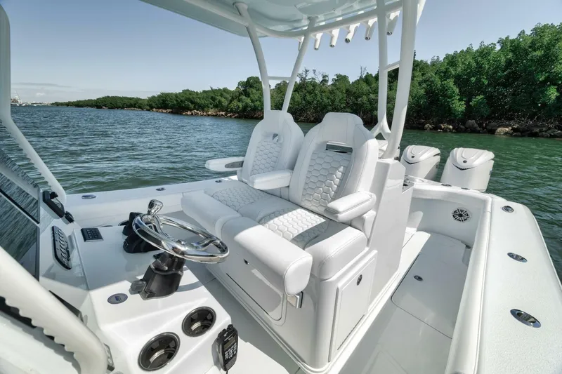 Slide: The Image of 2025 Yellowfin 36 Offshore boat interior with luxurious seating and modern controls. - 28