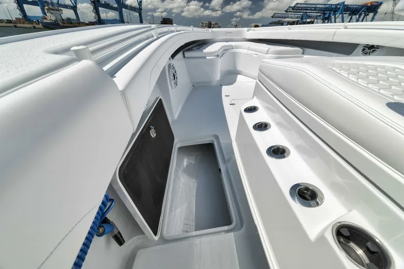 Slide: The Image of 2025 Yellowfin 36 Offshore boat interior with storage compartments and rod holders. - 31