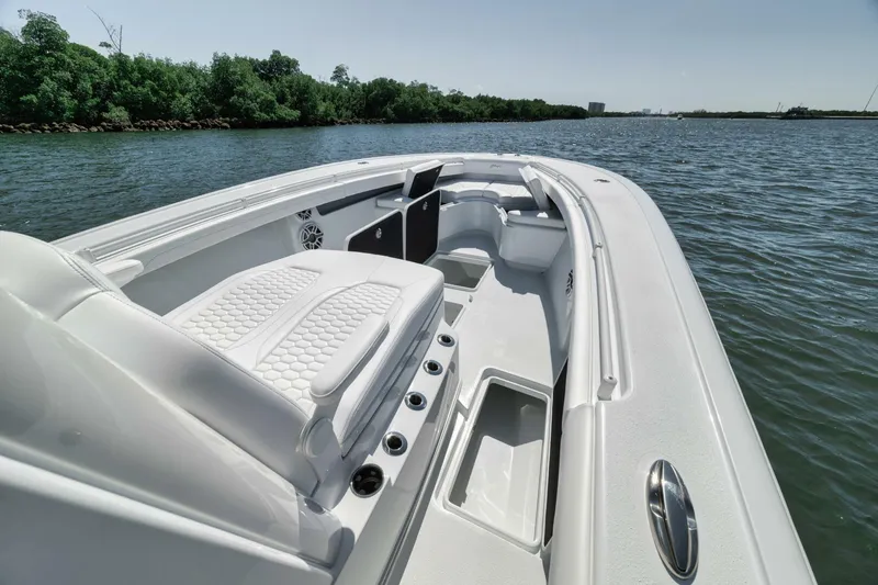 Slide: The Image of 2025 Yellowfin 36 Offshore boat interior with sleek seating on calm water. - 32