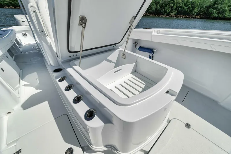 Slide: The Image of 2025 Yellowfin 36 Offshore boat with open storage compartment on deck. - 34