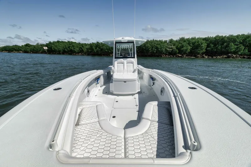 Slide: The Image of 2025 Yellowfin 36 Offshore boat on water, featuring spacious deck and modern design. - 35