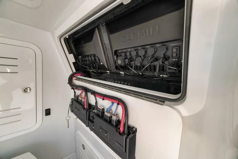 Slide: The Image of 2025 Yellowfin 36 Offshore boat electronics panel with Garmin system and wiring. - 38