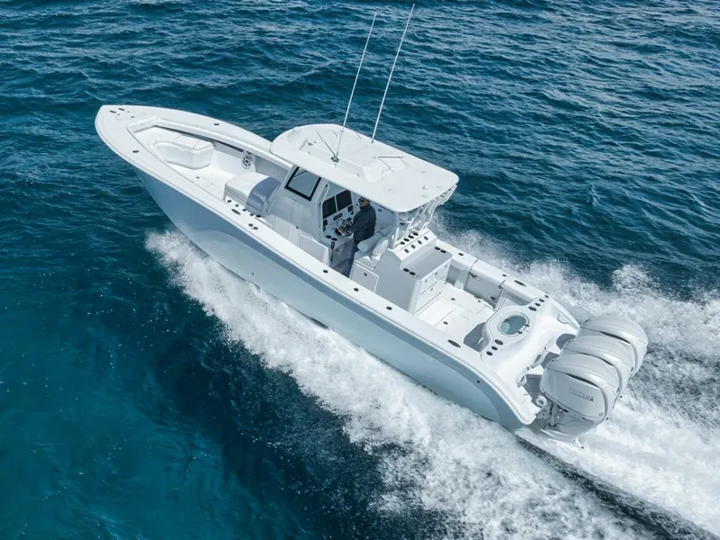 Slide: The Image of 2025 Yellowfin 36 Offshore boat cruising on open ocean waters. - 4