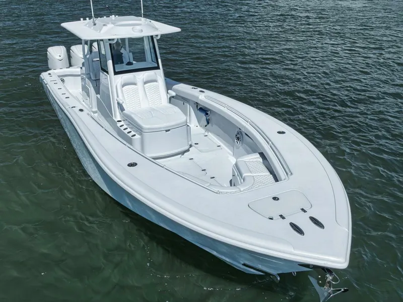 Slide: The Image of 2025 Yellowfin 36 Offshore boat on water, showcasing sleek design and spacious deck. - 42